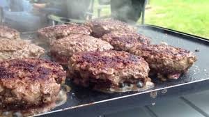 cooking burgers on a griddle